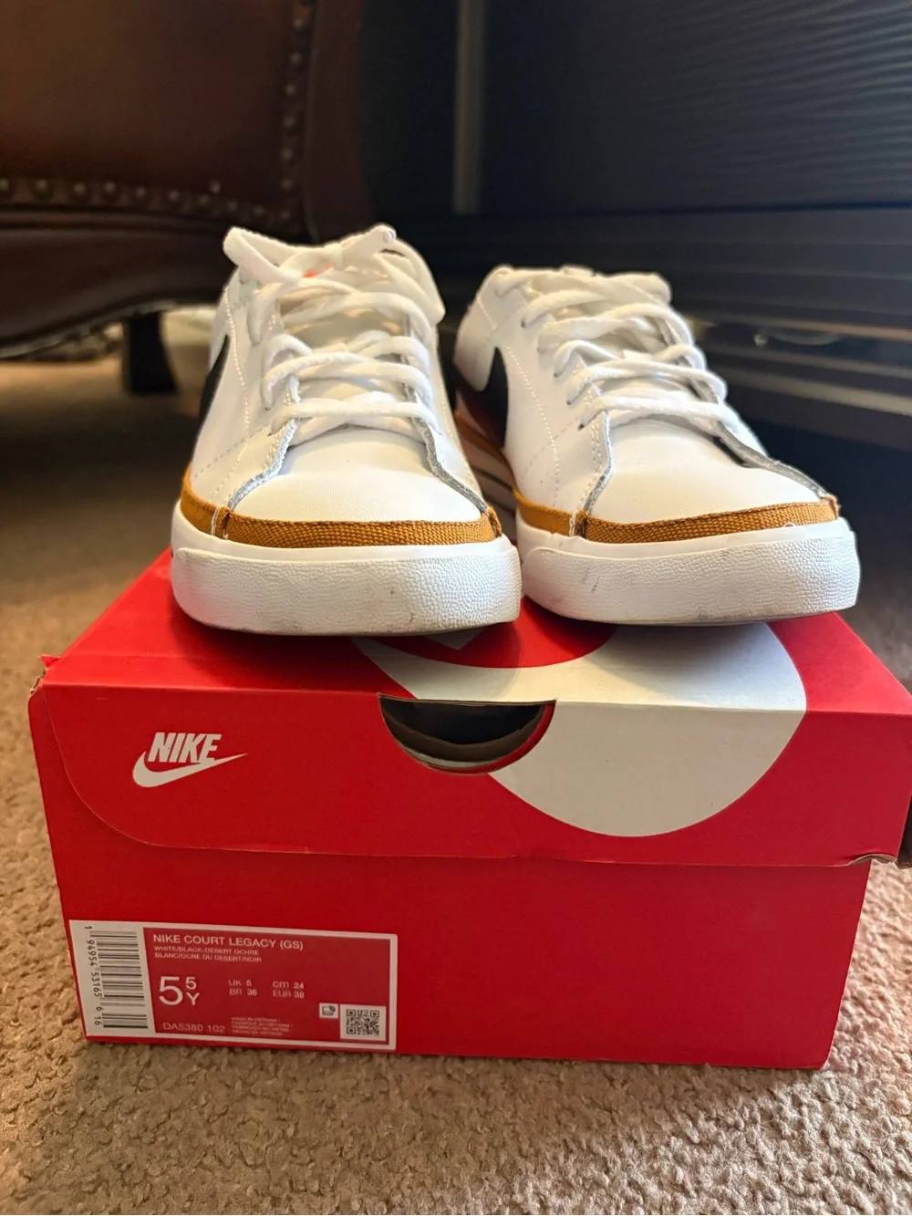 Nike White Sneakers with Black Swoosh and Gold Trim